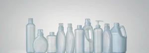 A row of blank household cleaning bottles used to illustrate packaging weight data for US state EPR reporting