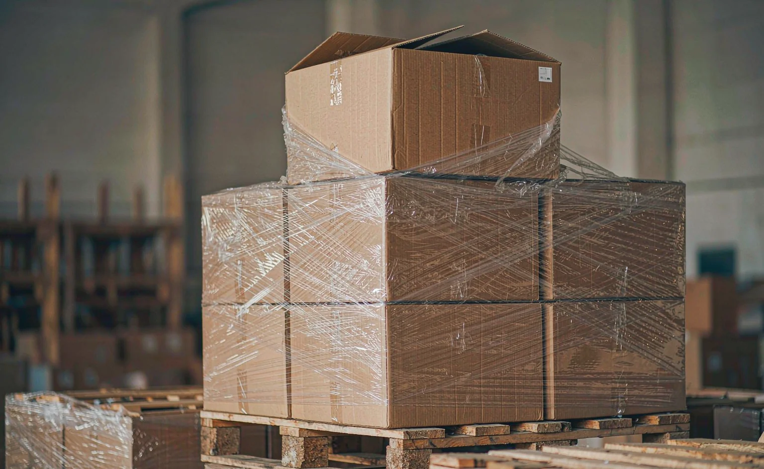 Blank-labeled export cartons stacked on a pallet, awaiting export booking for a Ramadan shipment